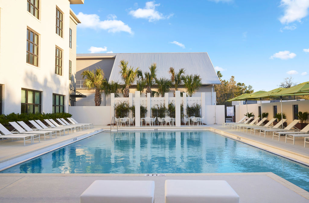shot of pool with lounge chairs